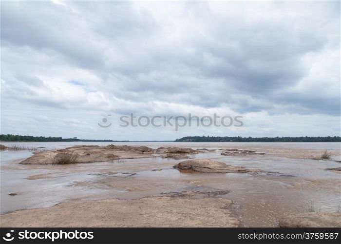Large Mekong River rocks in the river. Two rivers Thailand and Laos.