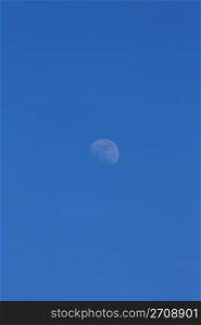 large moon on a background of blue sky