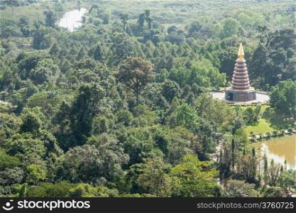 Large pagoda in the middle of the jungle View from the tower are seen near the pond.