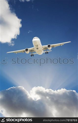 Large passenger airplane flying in the blue sky