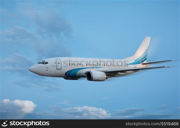 Large passenger plane flying in the blue sky
