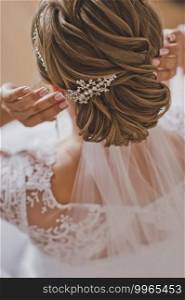 Large photo of the wedding hairstyle girls.. Wedding hairstyle of a beautiful girl close - up 2150.