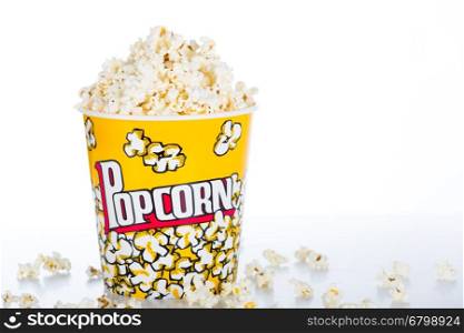 Large pot of popcorn on white background