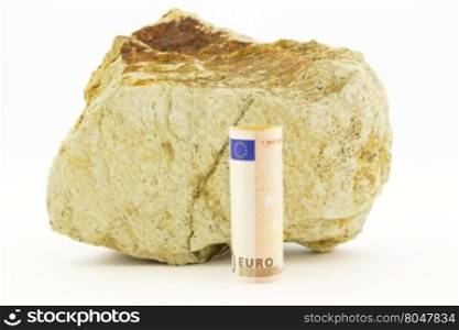 Large rock with crack line behind euro currency placed on white background depicts rough financial environment for European Union.