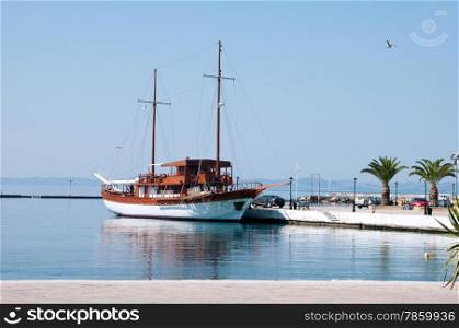 large sailing ship on an empty Greek waterfront