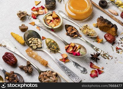 Large set of dried healing and medicinal herbs,plants.Dry tea leaf.Herbal medicine. Healing herbs in teaspoons