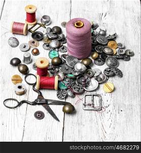 large set of threads and buttons. Spools of sewing threads and buttons from clothing