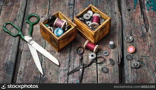 large set of threads and buttons. Spools of sewing threads and buttons from clothing