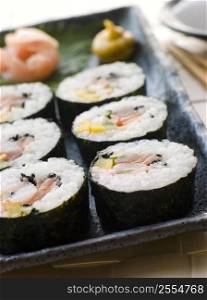 Large Spiral Rolled Sushi with Sushi Ginger Wasabi and Soy Sauce