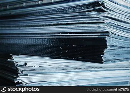 Large stack of magazines on table close-up