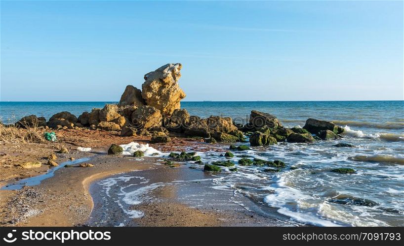 Large stones by the sea near the village of Fontanka, Odessa region, Ukraine. A scattering of large stones by the sea