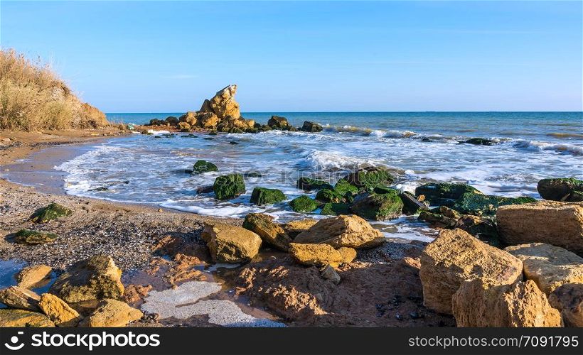 Large stones by the sea near the village of Fontanka, Odessa region, Ukraine. A scattering of large stones by the sea