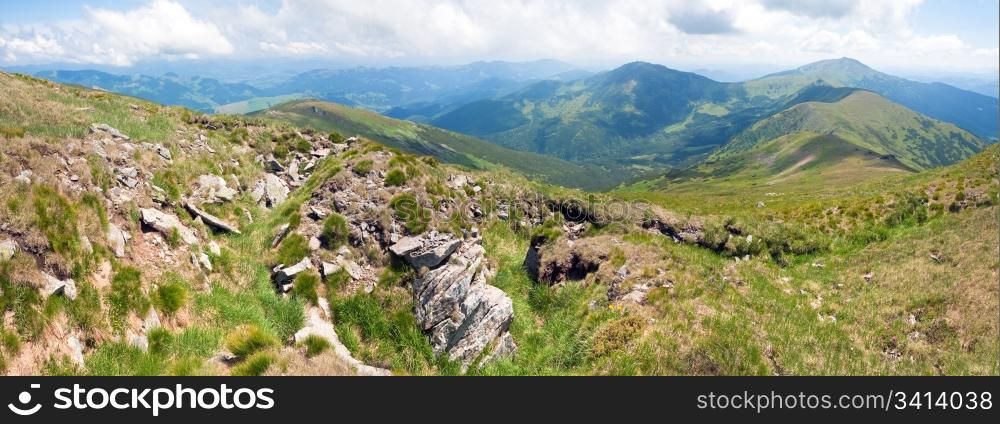 Large stones on summer mountainside (Ukraine, Carpathian Mountains). Three shots stitch image.