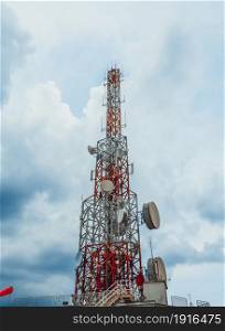 Large telecommunication tower against sky and clouds in background . Internet network connection concept .. Large telecommunication tower against sky and clouds in background