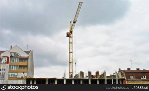 large tower crane at construction site, timelapse