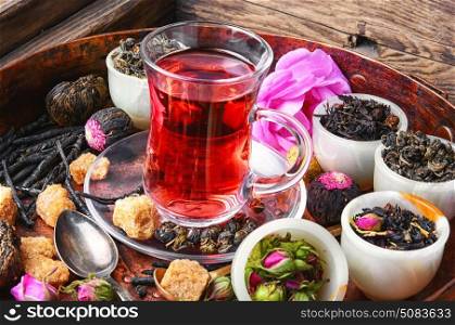 large variety black tea,green tea,rose tea in a copper tray. cup with east tea