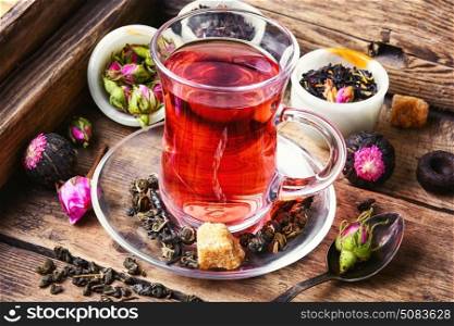 large variety black tea,green tea,rose tea on wooden background. Tea cup and herbal tea