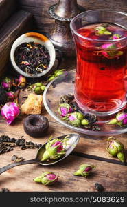 large variety black tea,green tea,rose tea on wooden background. Tea cup with and tea leaf