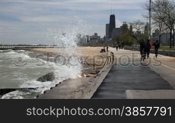 Large waves splashing against the Lake Shore Path along Lake Michigan in Chicago