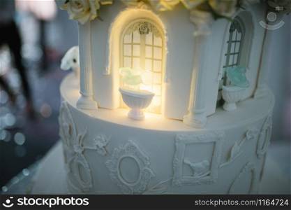 Large white wedding cake with castle shaped towers close up. Large white wedding cake with castle shaped towers