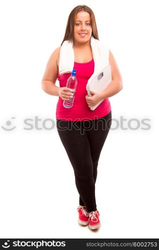 Large woman holding a scale - diet concept