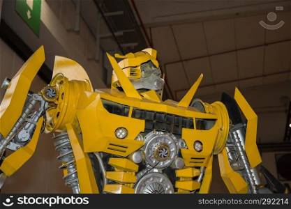 Large Yellow Robot Built with Automobile Parts.. Large Yellow Robot Built with Automobile Parts