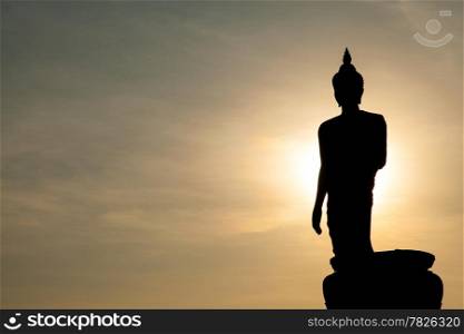 Larger Buddha. In the evening. The black silhouette of a Buddha statue.