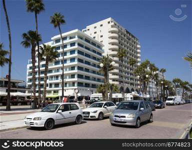 LARNACA, CYPRUS - MARCH 23,2015 : Seafront walkway at Foinikoudes Beach Larnaca on the south coast of the Mediterranean island of Cyprus.