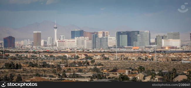 Las vegas city surrounded by red rock mountains and valley of fire