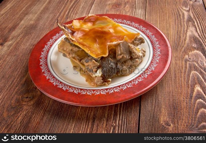Lasagna with mushrooms and beef.close up. farm-style