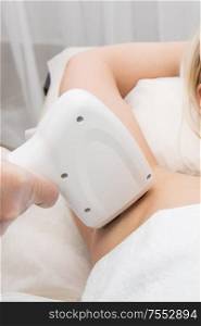 Laser epilation of armpits, hair removal cosmetology procedure. Health and beauty concept.. Laser epilation of armpits
