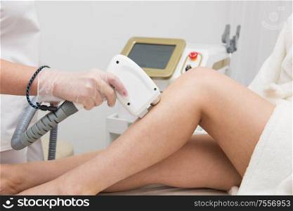 Laser epilation of legs, hair removal cosmetology procedure. Health and beauty concept.. Laser epilation of legs