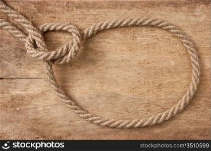 lasso rope on a wooden background