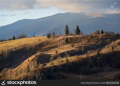 Last good weather days in autumn mountain countryside. Peaceful picturesque Ukrainian Carpathians mountains scene.