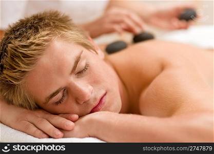 Lastone therapy - man at luxury massage in spa center