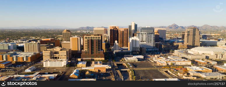 Late afternoon sun lights the buildings in the downtown urban core of Phoenix Arizona