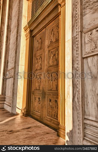 Late afternoon winter sun illuminates front doors of supreme court in Washington