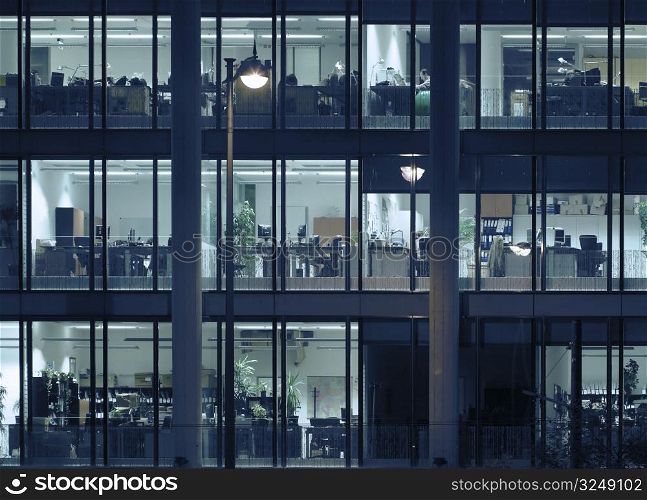 Late night overtime in a modern office building.