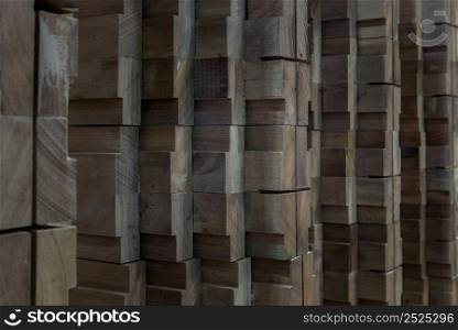 Lateral view of Wood that has been processed and cut, neatly arranged to form an interesting pattern. Copy space, Selective focus.