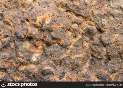 Laterite stone texture or stone background. Stone texture for design. Real stone texture. Stone texture in brown tone