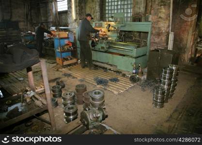 Lathe and the turner at a machine-building factory