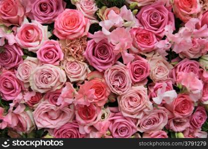Lathyrus and roses in a pink wedding arrangement