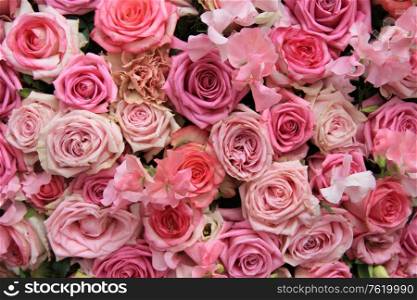 Lathyrus and roses in a pink wedding arrangement