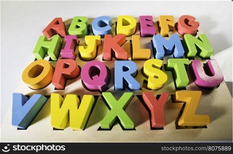 Latin alphabet multicolored wooden letters