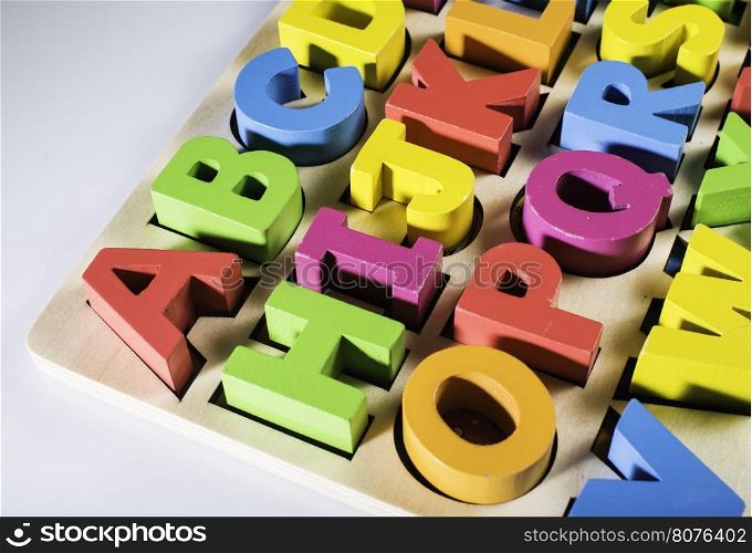 Latin alphabet multicolored wooden letters