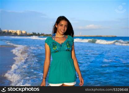 Latin beautiful girl in Caribbean beach sunset with embroidery dress