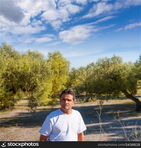 latin farmer in Mediterranean Olive tree field of Spain