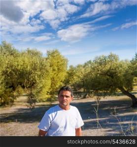 latin farmer in Mediterranean Olive tree field of Spain