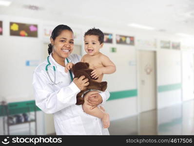 Latin pediatrician at the hospital with a beautiful baby