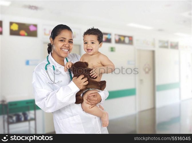 Latin pediatrician at the hospital with a beautiful baby